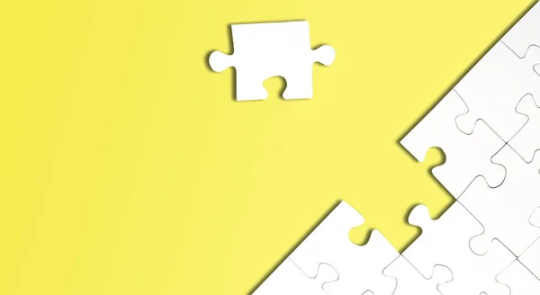 Top view of jigsaw puzzle with one piece left on yellow background — 스톡 사진