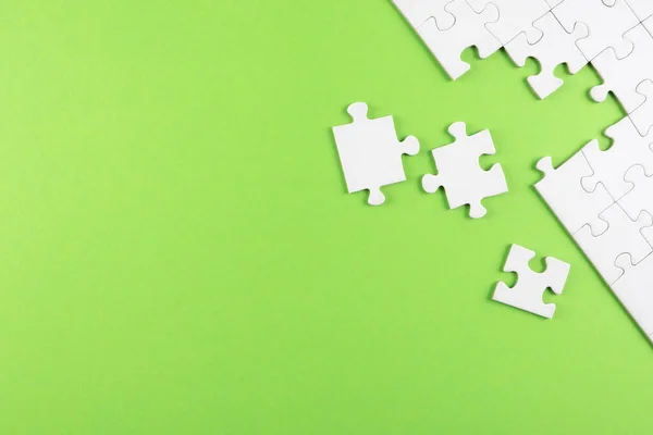 Top view of white blank unfinished jigsaw puzzle — Stockfoto