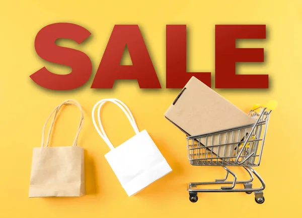 retail sale marketing concept with word SALE and shopping cart and bags