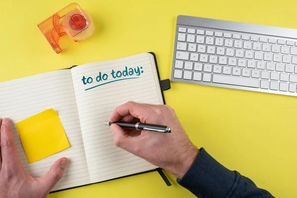 Top view of person writing to-do list on notebook — Stock Photo, Image