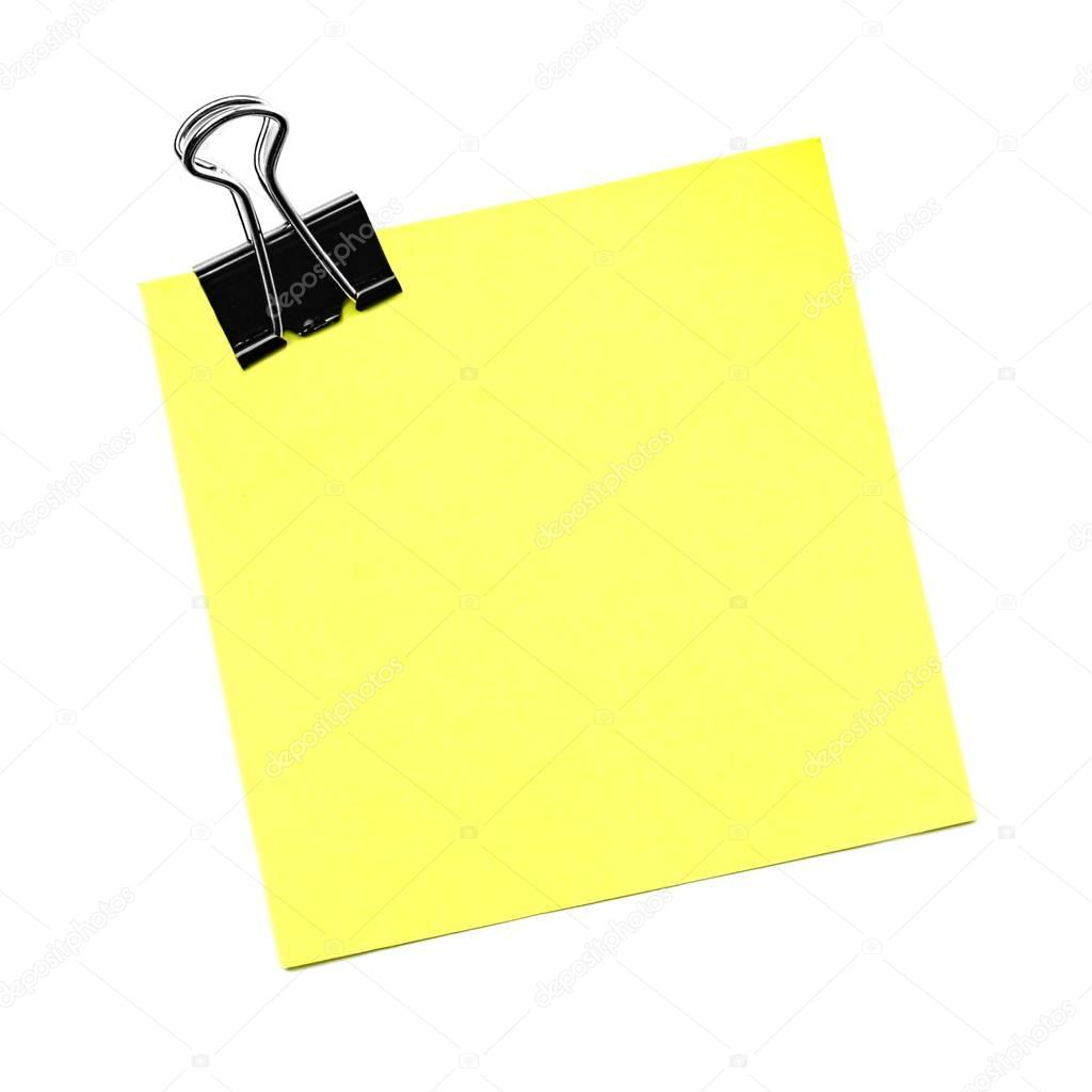 Yellow post note with paper clip isolated on white 