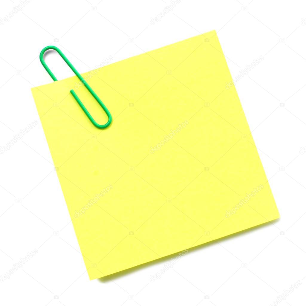 Sticky note with green paper clip isolated on white 