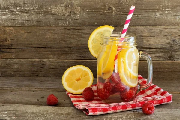 Detox water with lemon and raspberries