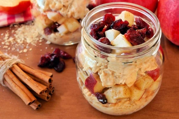 Overnight oats with apples and cranberries in a mason jar — Stock Photo, Image