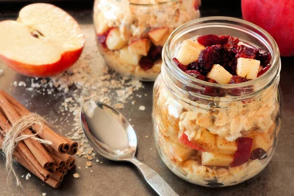 Overnight oats with apples and cranberries in a mason jar — Stock Photo, Image