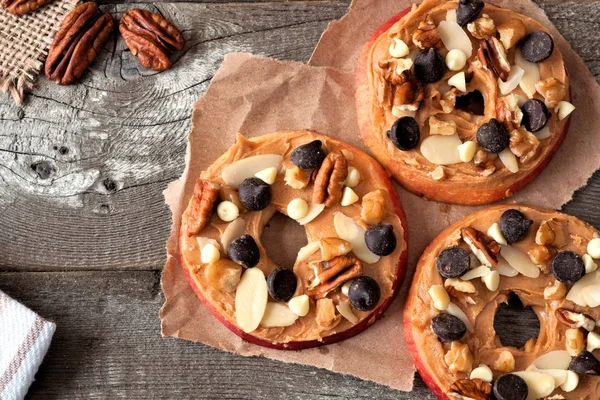 Autumn apple rounds with a rustic wood background — Stock Photo, Image