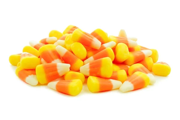 Pile of Halloween candy corn over white — Stock Photo, Image