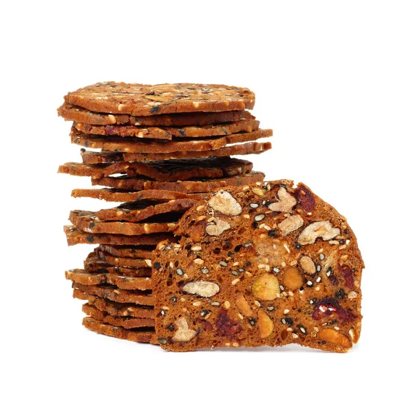 Crisps with cranberries, nuts and seeds stacked — Stock Photo, Image