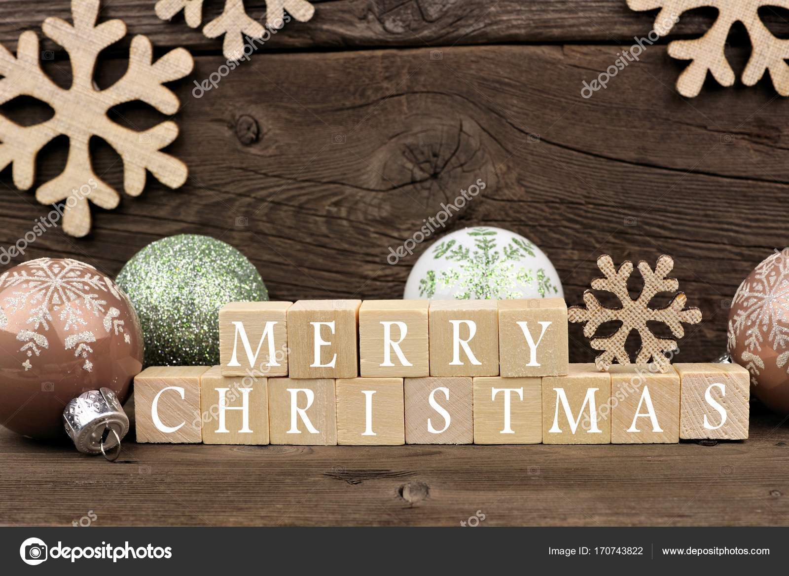 Merry Christmas wooden blocks with decor on rustic wood Stock Photo by