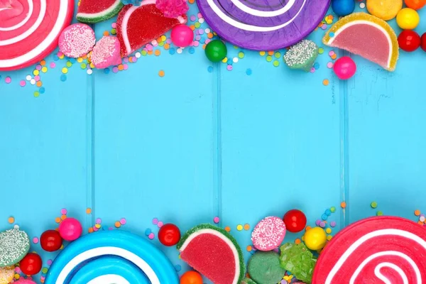 彩色糖果双边框与蓝色木背景 — 图库照片