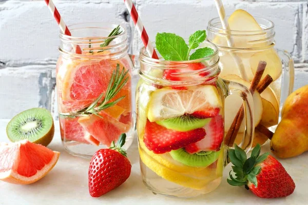 Assortment Detox Water Fruit Mason Jar Glasses White Brick Background — Stock Photo, Image