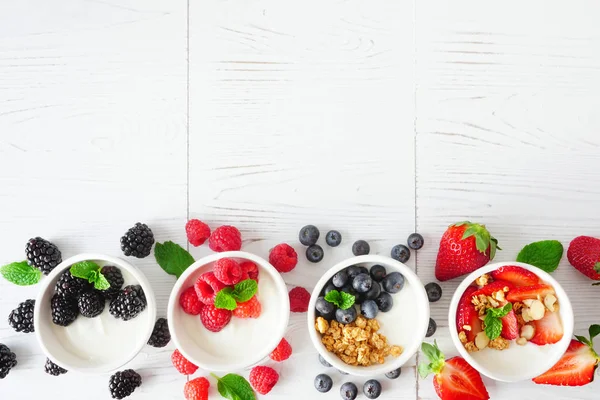 Healthy Yogurt Bowls Assorted Berries Granola Bottom Border White Wood — 스톡 사진
