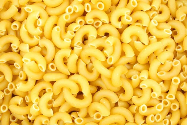 Volledige Achtergrond Van Droge Ongekookte Macaroni Pasta — Stockfoto