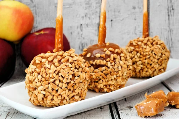 Autumn Caramel Apples Nuts Plate Rustic White Wood Background — Stock Photo, Image