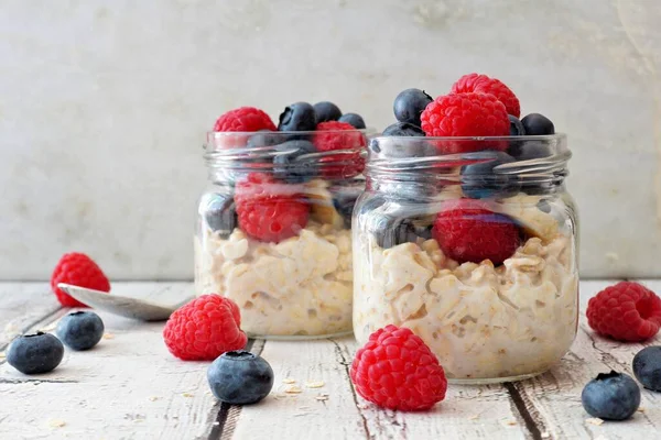 Overnight Oats Fresh Blueberries Raspberries Jars Rustic White Wood Background — Stock Photo, Image