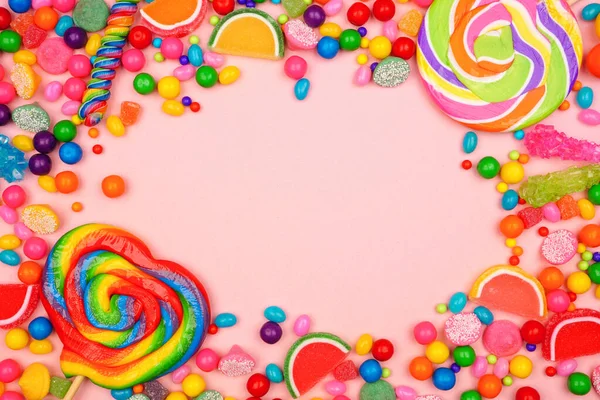 Renkli Şeker Çeşitleri Üst Çerçeve Pembe Arkaplan Üzerinde — Stok fotoğraf