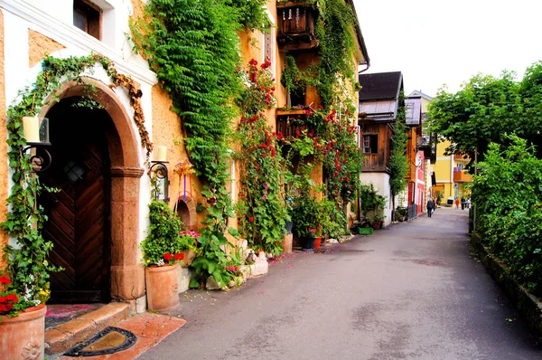 Flower lined street in the traditional Austrian village of Hallstatt
