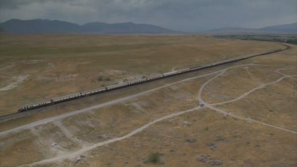 Aerial shot of amtrak train and desert town — Stock Video