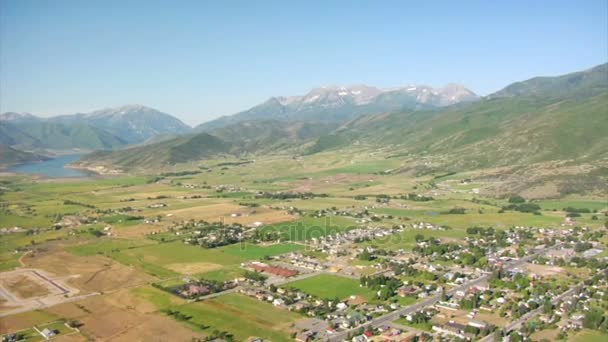 Aerial shot of mountain farming community — Stock Video