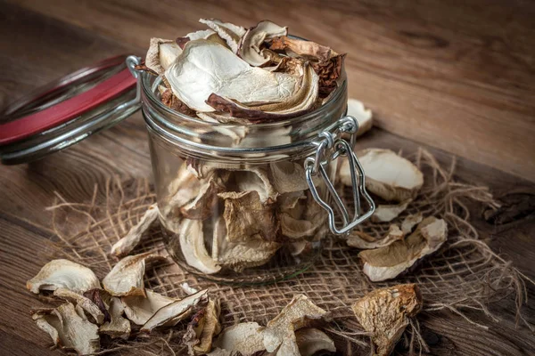 Dried mushrooms in jar. — Stock Photo, Image