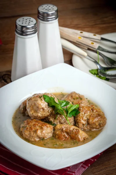 Pork meatballs with dill sauce. — Stock Photo, Image