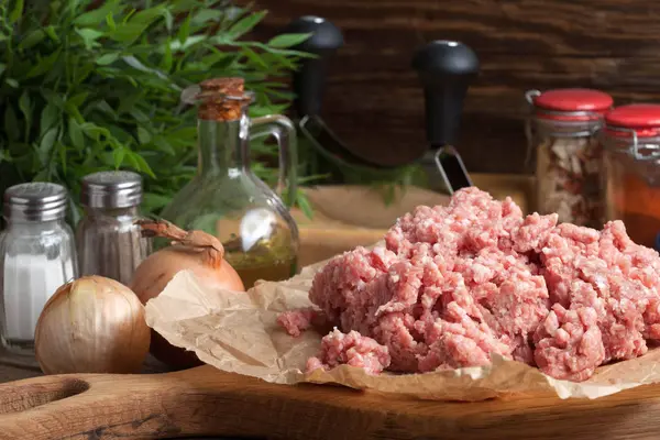 Minced meat on wooden background. — Stock Photo, Image