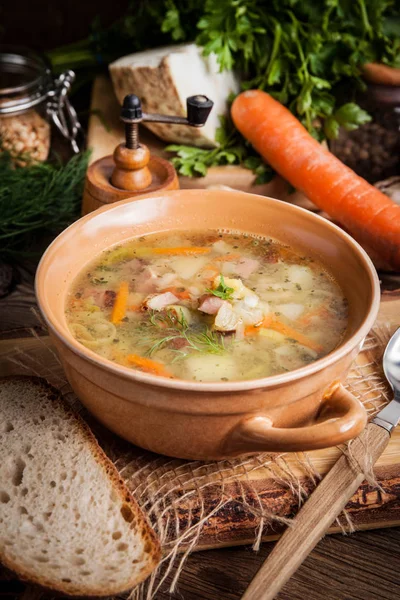 Pea soup with vegetables and bacon. — Stock Photo, Image