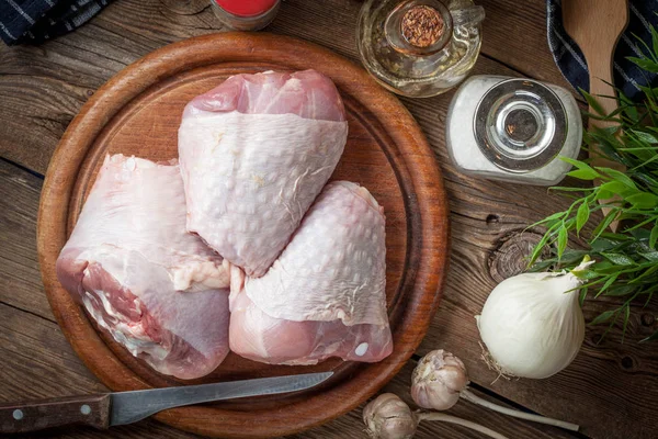 Raw turkey legs on cutting board. — Stock Photo, Image
