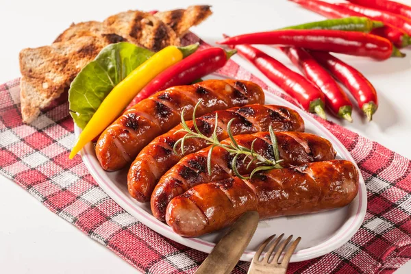 Grilled sausage on a plate. — Stock Photo, Image