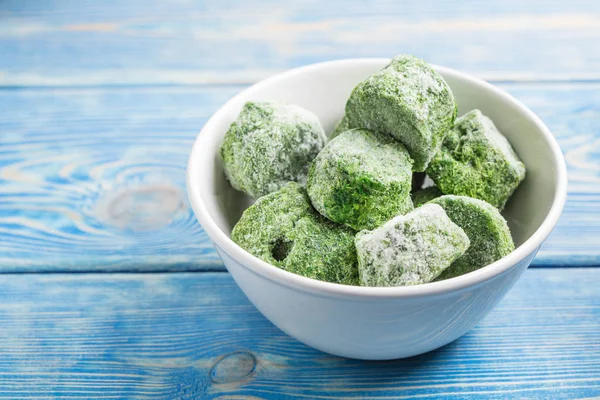 Frozen spinach blocks. — Stock Photo, Image