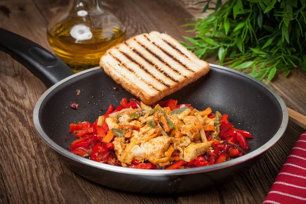 Fried chicken pieces with vegetables.