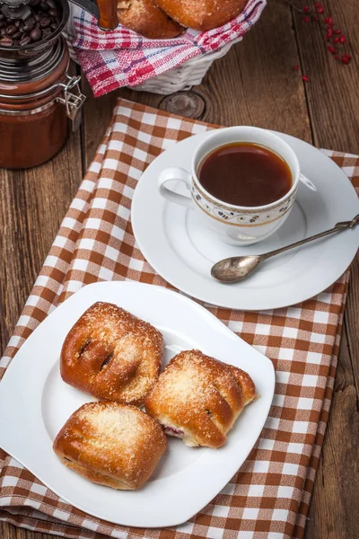 Buns with berries on a wooden table. — Stock Photo, Image