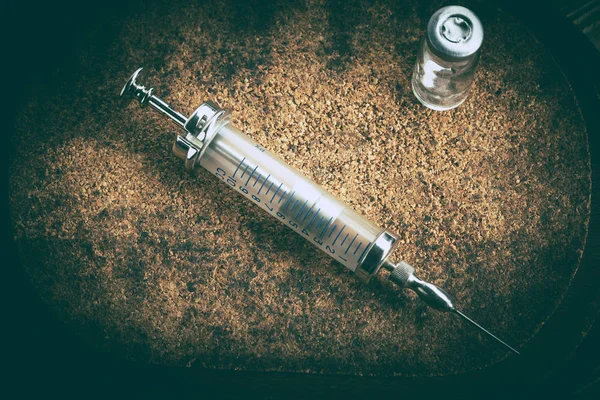 Old medicine equipment on wooden background.