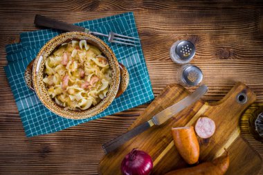 Pasta with sauerkraut and sausage.