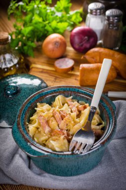 Pasta with sauerkraut and sausage.