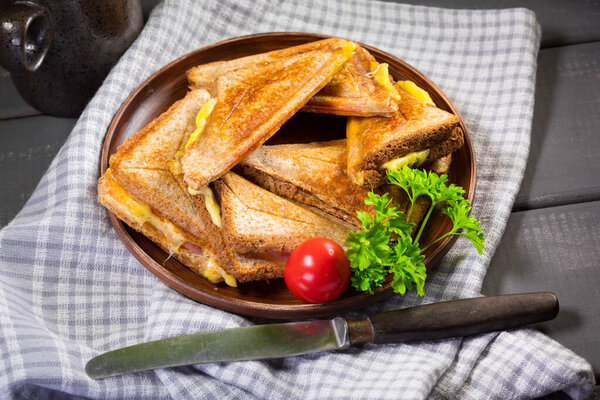 Grilled cheese sandwich on plate. Shallow depth of field.