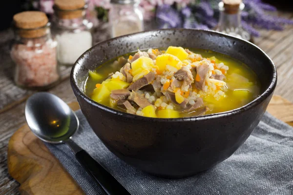 Polish barley soup with vegetables and chicken heart - krupnik.