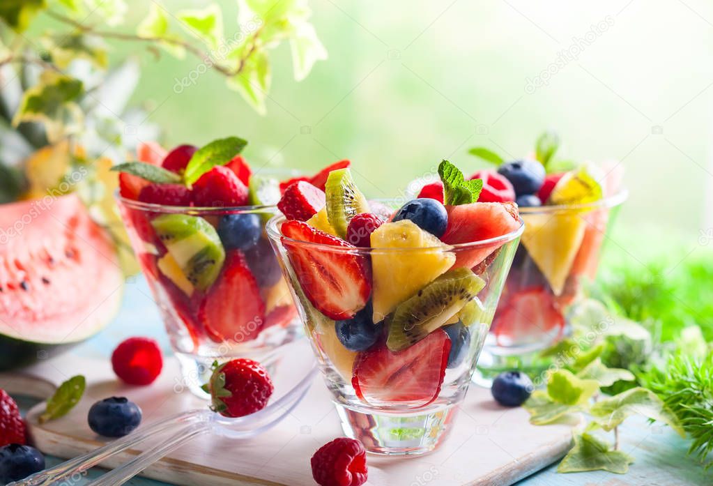 Fruit and berry salad in glasses