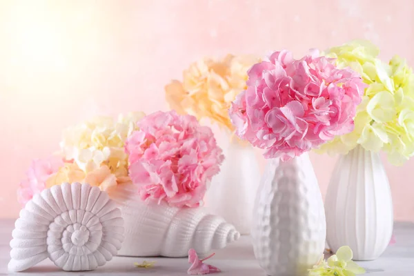 Bouquets of beautiful hydrangea in vases — Stock Photo, Image