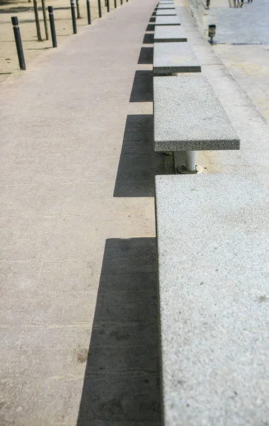 Stoned beaches in a row with its shadows — Stock Photo, Image