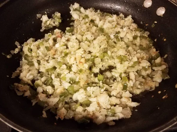 Frying pan with fish and oil and green peppers and onion — ストック写真