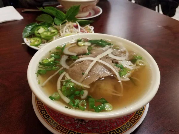 Bowl of Vietnamese soup with beef and onions — 스톡 사진