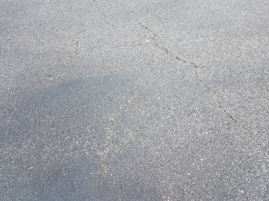 black asphalt or pavement or ground with crack