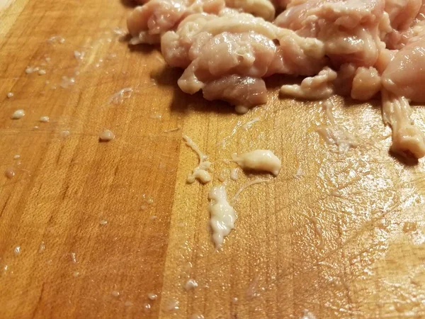 Raw chicken meat on wood cutting board — Stock Photo, Image