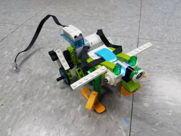 animal robot made from plastic blocks on floor