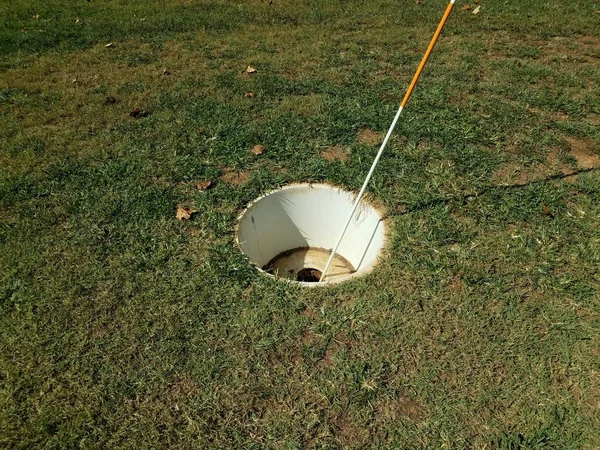 Large cup or hole with flag stick for foot golf — Stock Photo, Image