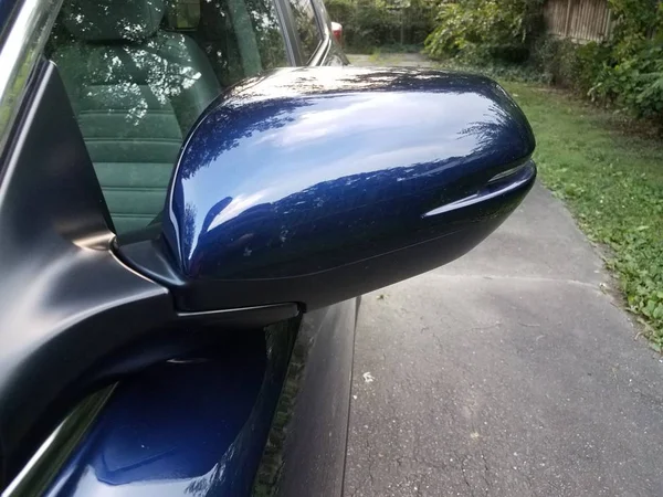 Side mirror on blue vehicle or car and asphalt — Stock Photo, Image