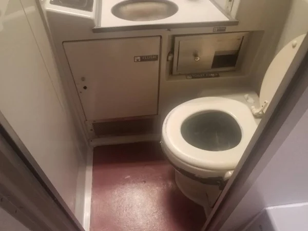 Toilet and sink in bathroom on train — Stock Photo, Image