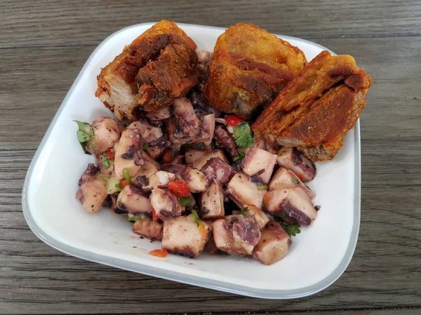 Octopus salad and fried pork Puerto Rican food in white bowl — 스톡 사진