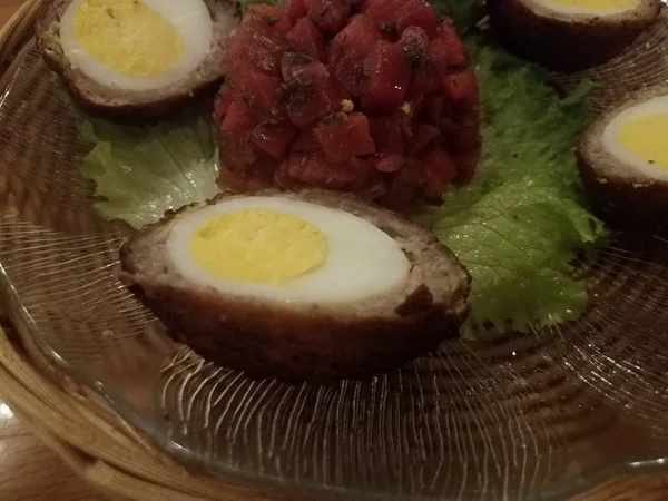 Scotch eggs with sausage and beets and lettuce — Stock Photo, Image